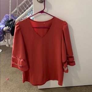 Shirt no stains it’s like an orange and pink.